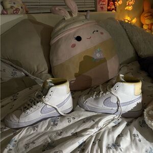 White and Purple High-Top Nike Sneakers